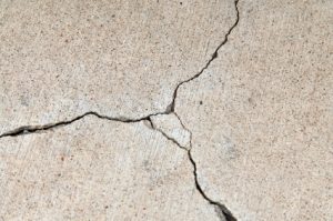 Cracks in driveway can broaden and get worse during winter weather